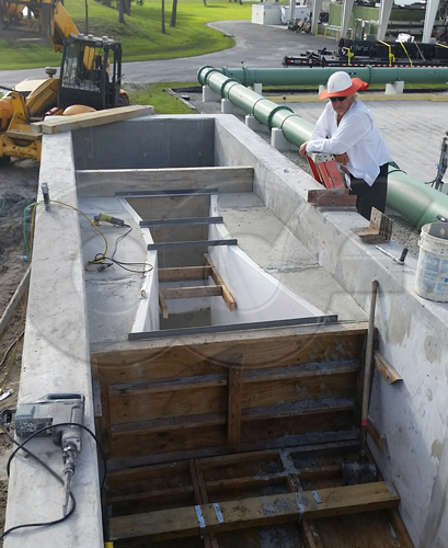 a parshall flume being installed at a florida wastewater treatment plant - wwtp