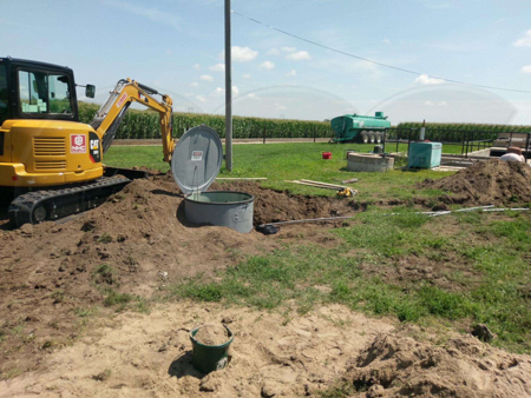 backfilling a metering manhole installation