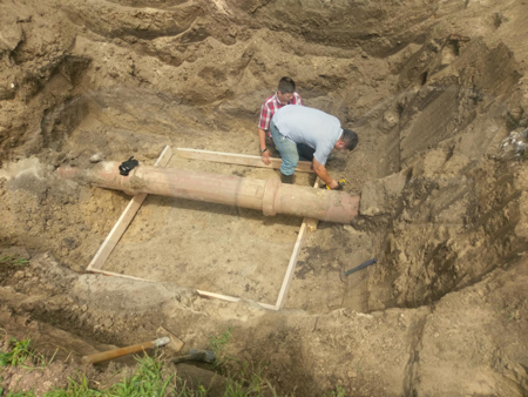 framework for forming the concrete mounting pad for a packaged metering manhole