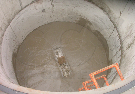 Bench poured around a Palmer Bowlus flume as part of the installation process - debris in the flume should have been cleared out prior to this point