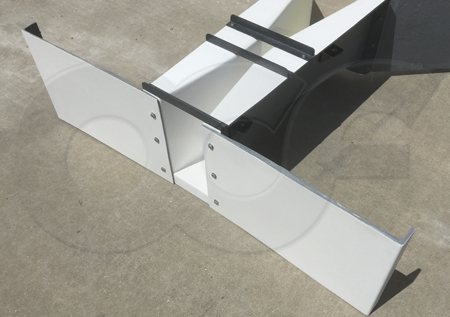 bolt-on outlet wing walls on a fiberglass Parshall flume