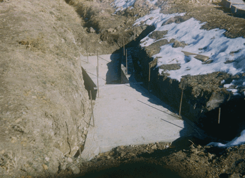 concrete base for Parshall flume in earthen channel