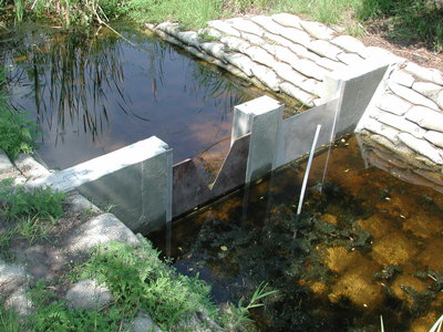 v-notch weir measuring irrigation - water rights flow - from a creek