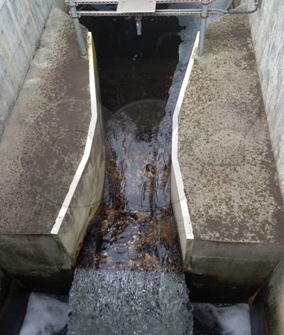 fiberglass parshall flume measuring effluent out of a wastewater treatment plant