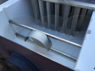 energy absorber and tranquilizer rack mounted in H flume approach section