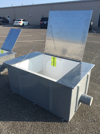 hinged diamond plate cover cover a fiberglass weir box with staff gauge