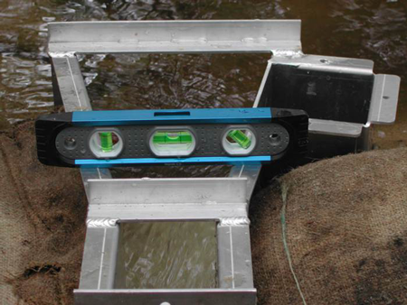 Leveling a USGS portable Parshall Flume during the installation process