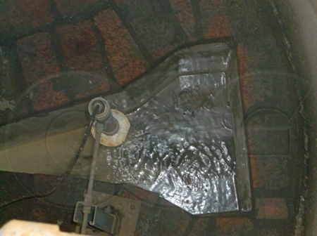 Parshall flume in a concrete manhole measuring sewage flows