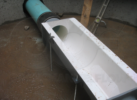 Leveling the Palmer Bowlus flume during installation. Threaded rod is run through the anchor clips in three locations. In the last location a clamp is used on the top of the flume. The anchor clip at this location came off when the contractor accidentally dropped the flume 8-feet down into the manhole. Other than the anchor clip, there was no harm to the flume!