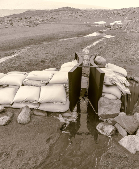 sand bags used as wing walls on a Parshall flume