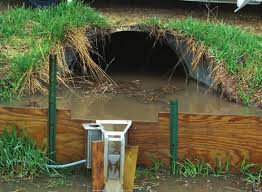 Plywood wing walls on a modified Parshall flume