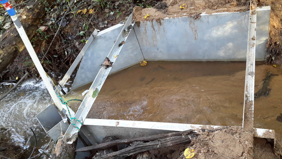 sediment in the approach of a metal H flume measuring stream flow