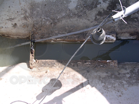 Submerged Flow in a Palmer Bowlus Flume - note the lack of a frothy wave (or any depression of the surface of the water)