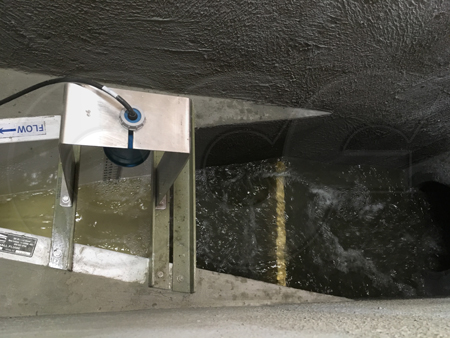 swirling flow in a field-formed pipe-to-Parshall flume transition channel