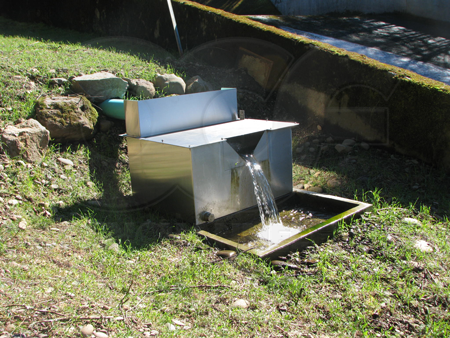 splash guard on a weir box measuring dam seepage