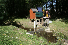 a v-notch weir used to measure flow in a small surface water stream