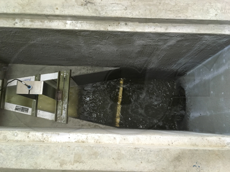turbulence in a field formed pipe-to-Parshall flume transition channel