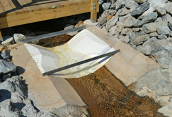 Openchannelflow Fiberglass Trapezoidal Flume measuring runoff at a utility