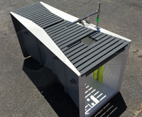 Recessed fiberglass grating over an Openchannelflow Parshall flume